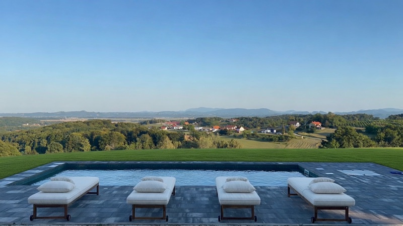 The private Villa pool at golden hour, looking out over the valley